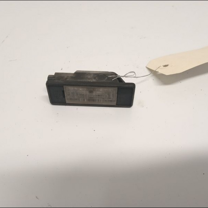 Eclaireur plaque de police g occasion NISSAN NOTE I Phase 1 03-2006->03-2009 1.4i 88ch 26510AU300 1