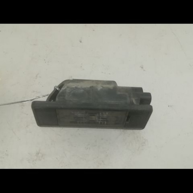 Eclaireur plaque de police g occasion NISSAN NOTE I phase 2 03-2009->02-2014 1.5 DCI 86ch 26510AU300 1