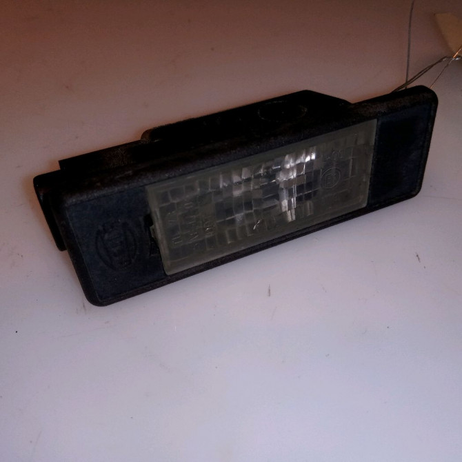 Eclaireur plaque de police g occasion NISSAN NOTE I phase 2 03-2009->02-2014 26510AU300 1