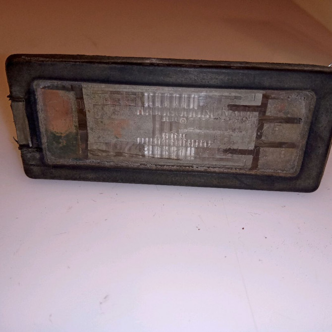 Eclaireur plaque de police g occasion RENAULT SCENIC II Phase 2 09-2006->04-2009 1.5 DCI 105ch 8200013577 1