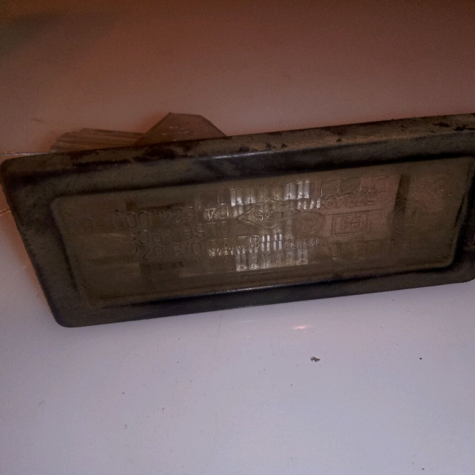 Eclaireur plaque de police g occasion RENAULT CLIO III phase 2 ESTATE 03-2009->12-2014 1.5 DCI 75ch 8200013577 1